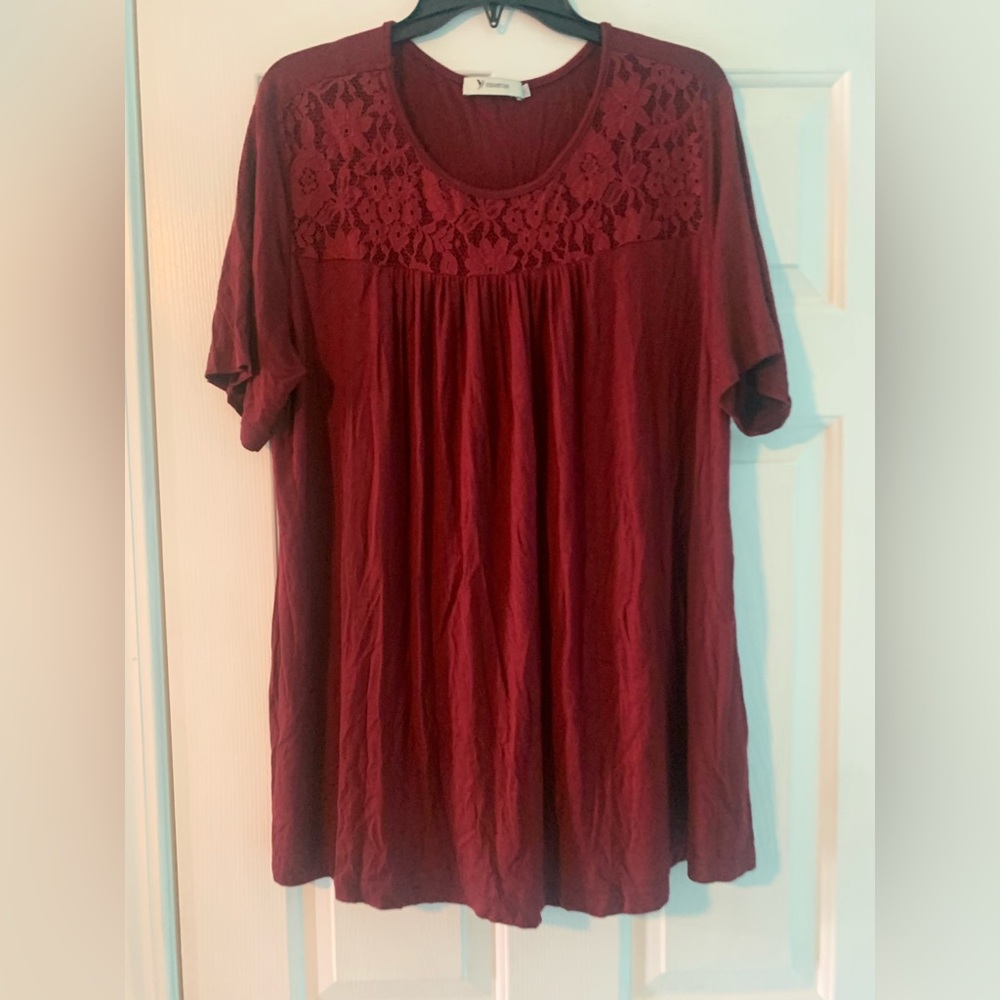 Burgundy colored top with lace on front